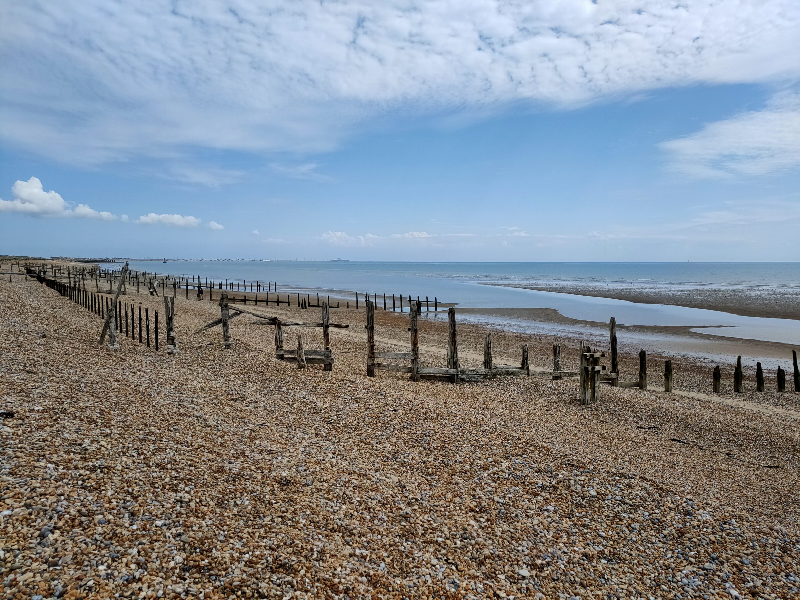 Shingle coast and open sky at Rye Harbour Nature Reserve in East Sussex